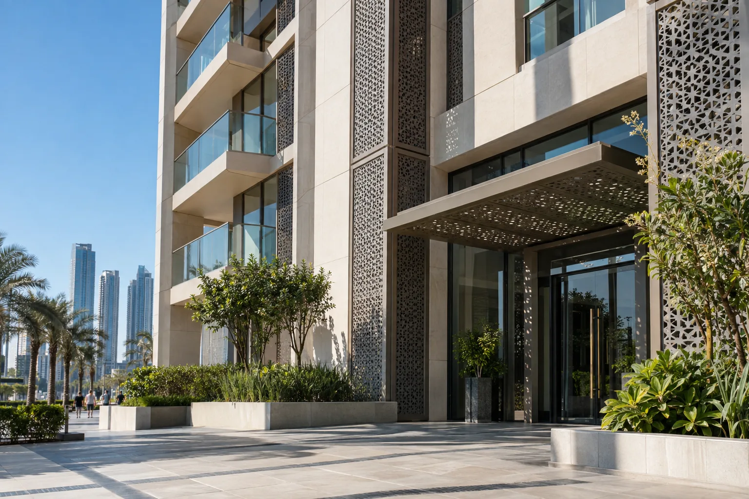 Entrance of a Reem Island residence with pale stone cladding and perforated metal sunshades in the sun