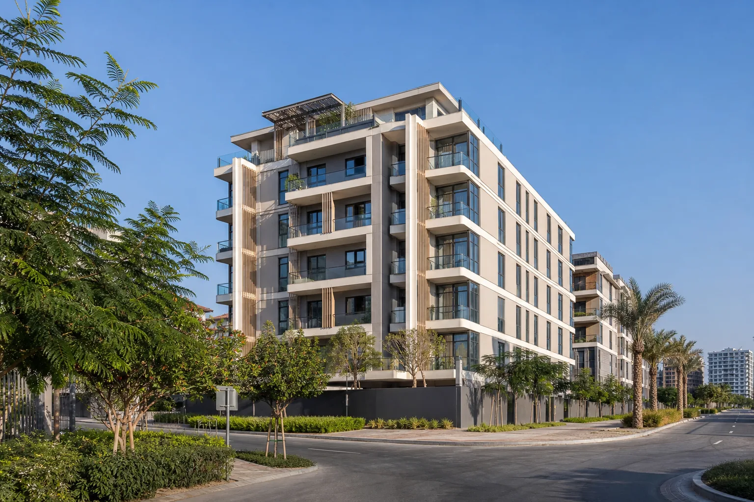 Fachada de una residencia contemporánea con estudios y apartamentos en Jumeirah Village Circle bajo un cielo despejado