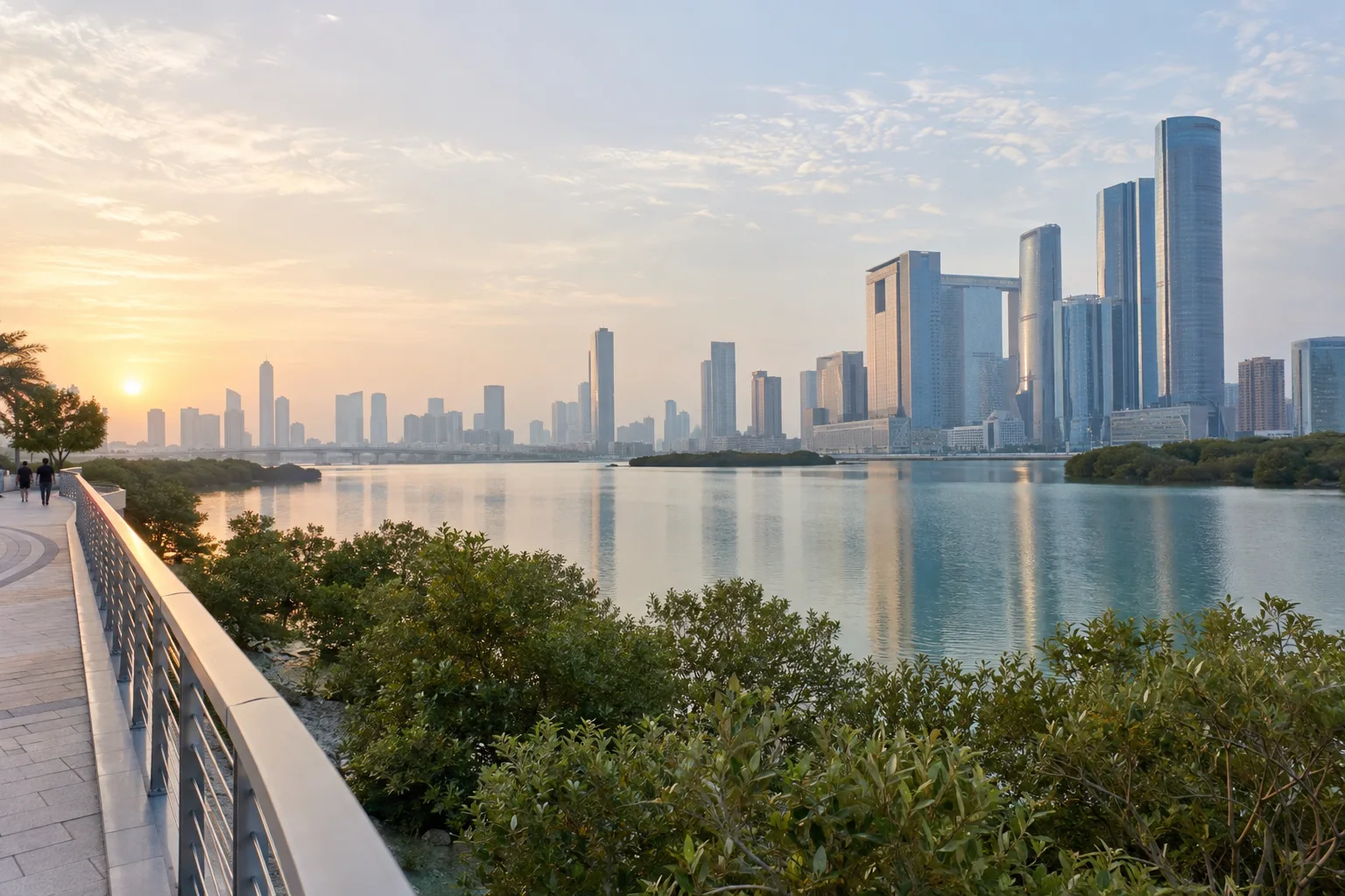 Wide view across the channel towards the Al Maryah Island financial district in the morning haze