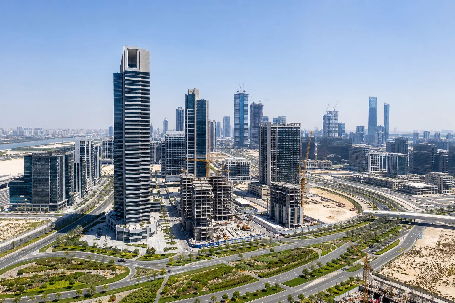New Dubai residential district under development seen from above with towers under construction and new infrastructure
